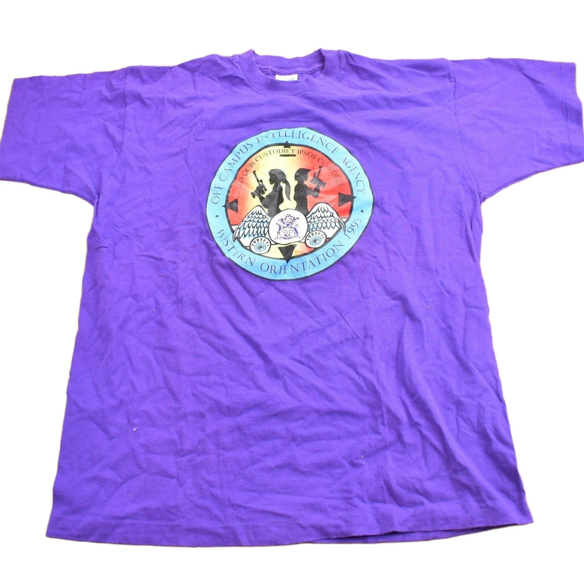 Vintage 1990s Off Campus International Agency Western Orientation Graphic T Shirt Men's XL